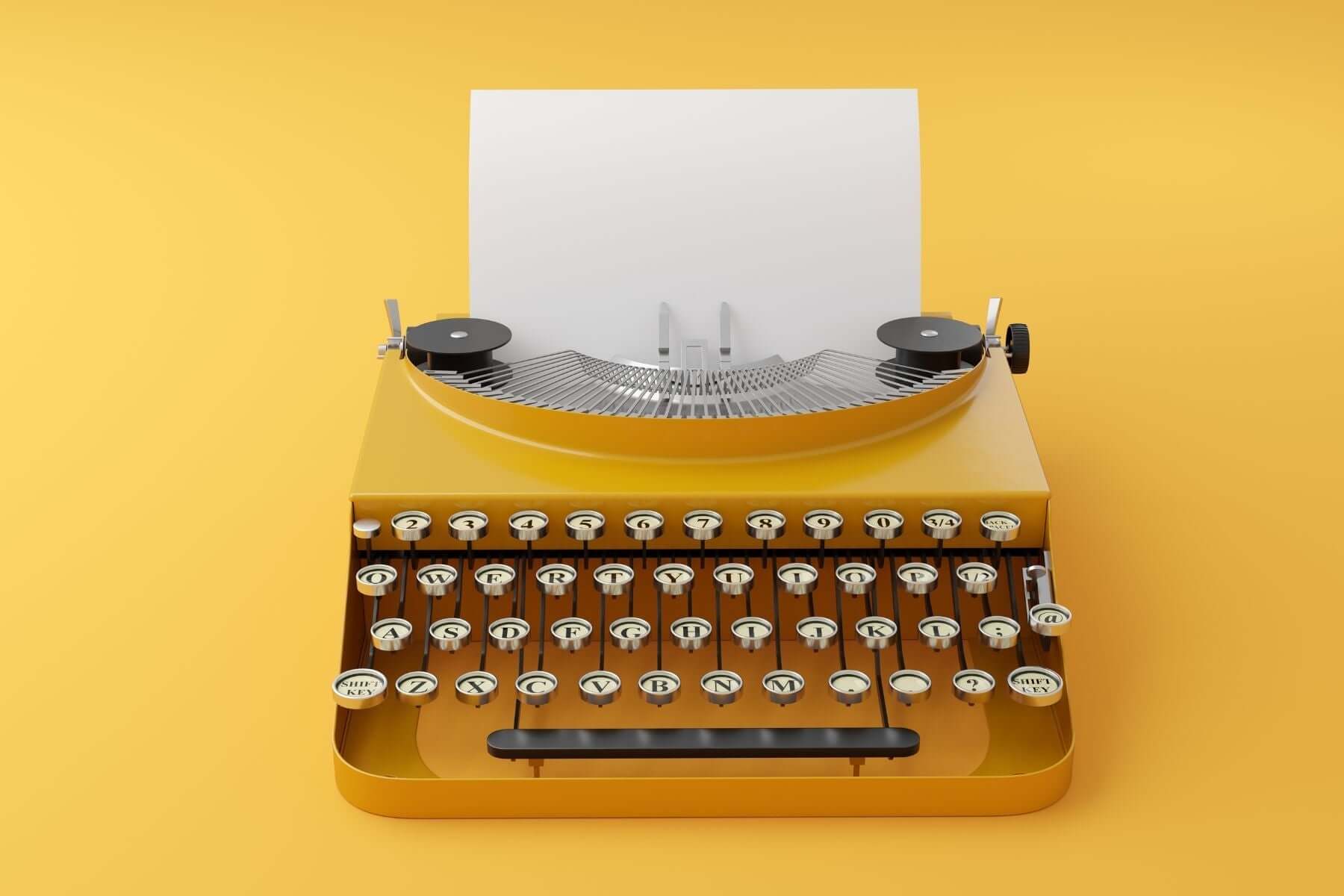 Bright yellow vintage typewriter with blank paper ready for creative writing.