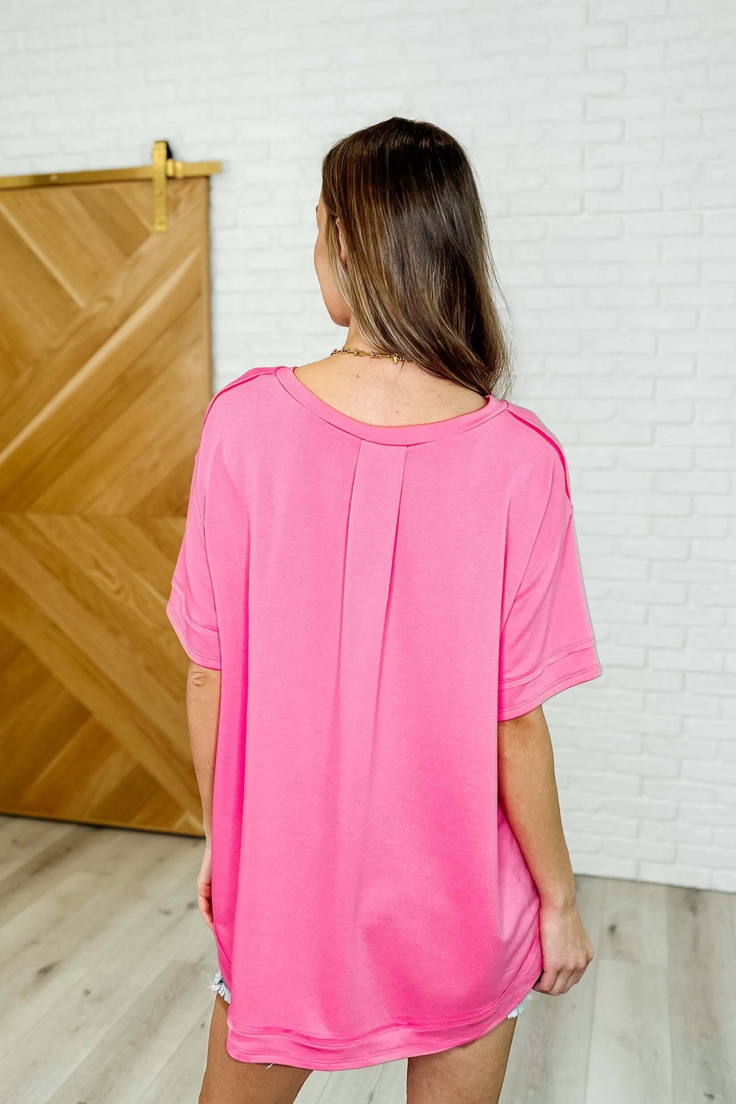 In the Rotation Exposed Seam Tee in Hot Pink