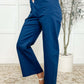 Model wearing Little Strolls Straight Leg Trousers in Royal Blue, showcasing cropped design and functional pockets.