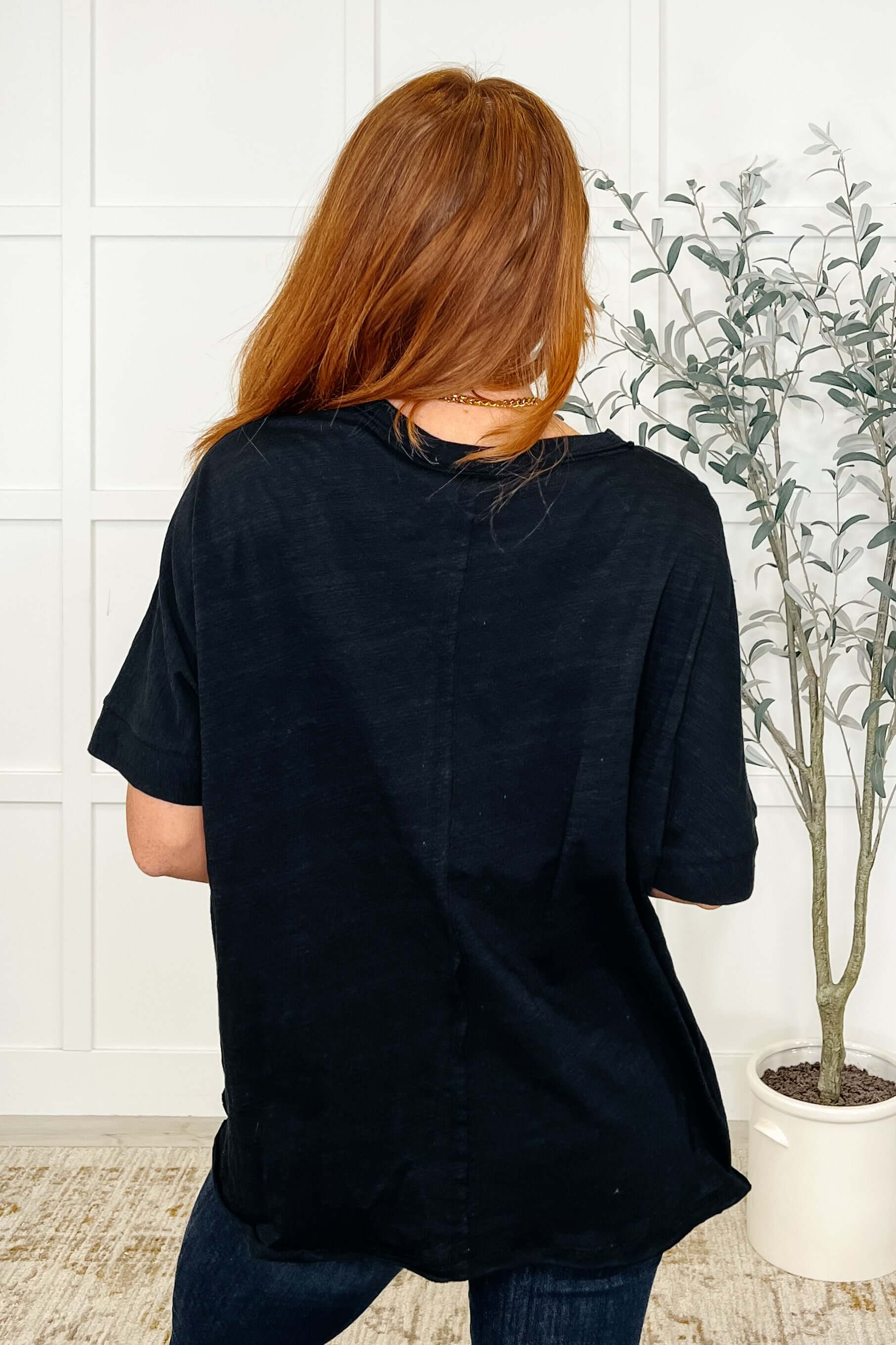 Back view of the Layback Relaxed Basic Tee in Black, showcasing its oversized fit and casual style.