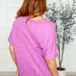 Back view of the Layback Relaxed Basic Tee in Hot Magenta, showcasing its oversized fit and lightweight jersey knit.