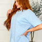 Model wearing the Layback Relaxed Basic Tee in light blue, featuring a slouchy pocket and oversized fit.