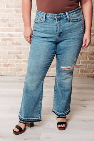 Isla Mid Rise Distressed Released Hem Bootcut Jeans - 1985 the VAULT Boutique